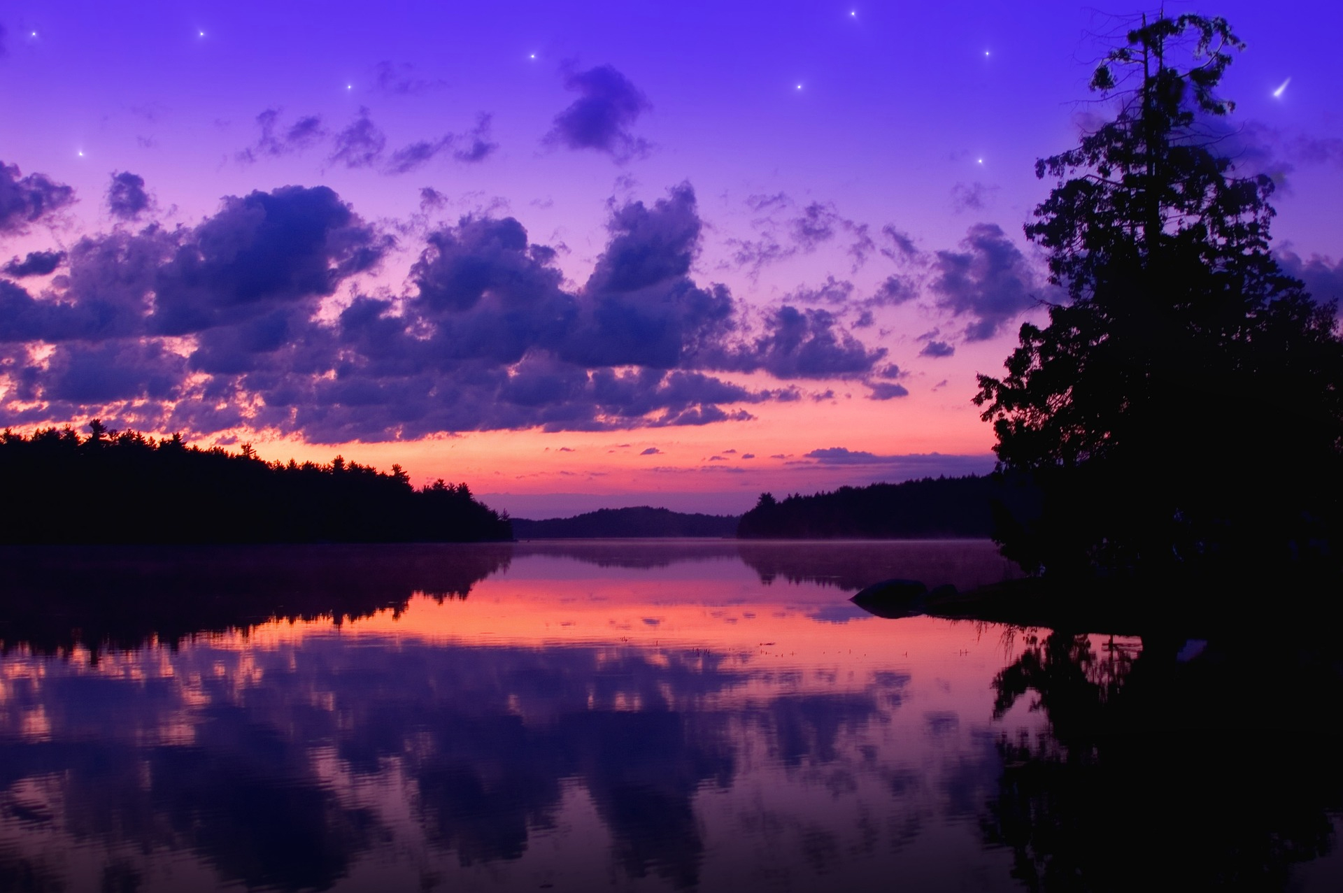 The stars begin to appear over the sunset skies of Luminary Lake. A shooting star can be seen in the distance ready for a wish to be made!