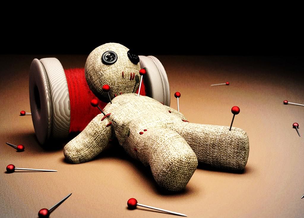 voodoo doll with needles