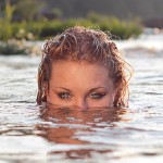 Mermaid Eyes Peering Over Surface Of Water